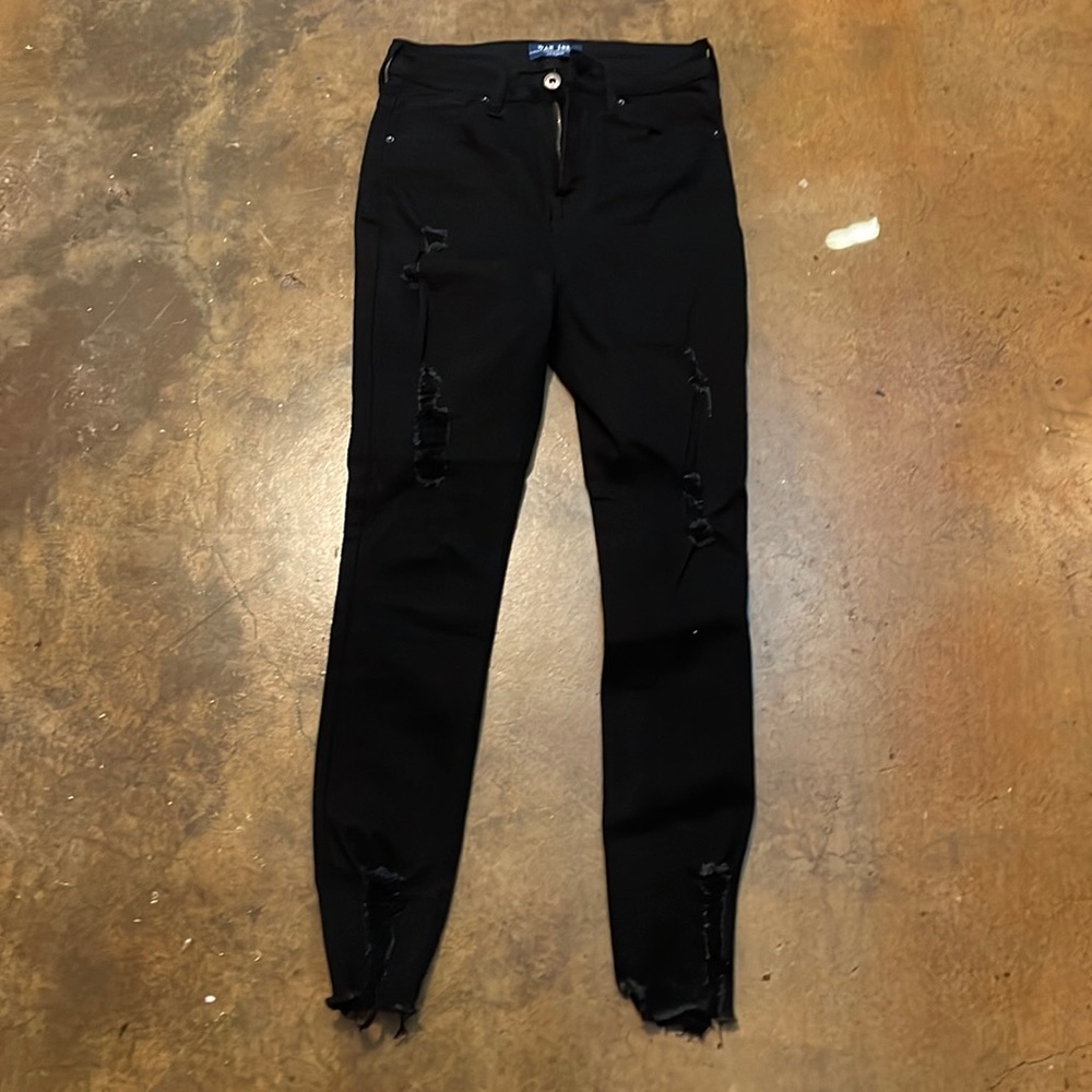 Black ripped jeans worn once. Size 1/25. Brand Wax Jeans